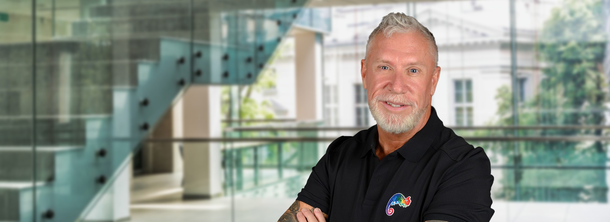 Terry M. Isner, Jaffe owner and CEO for branding and marketing, in a modern glass interior