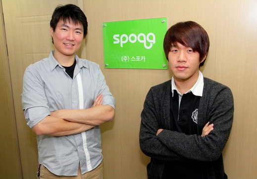 Jaiseung Choi, left, and CTO Jaeseok Kim standing beside the Spoqa sign in 2012