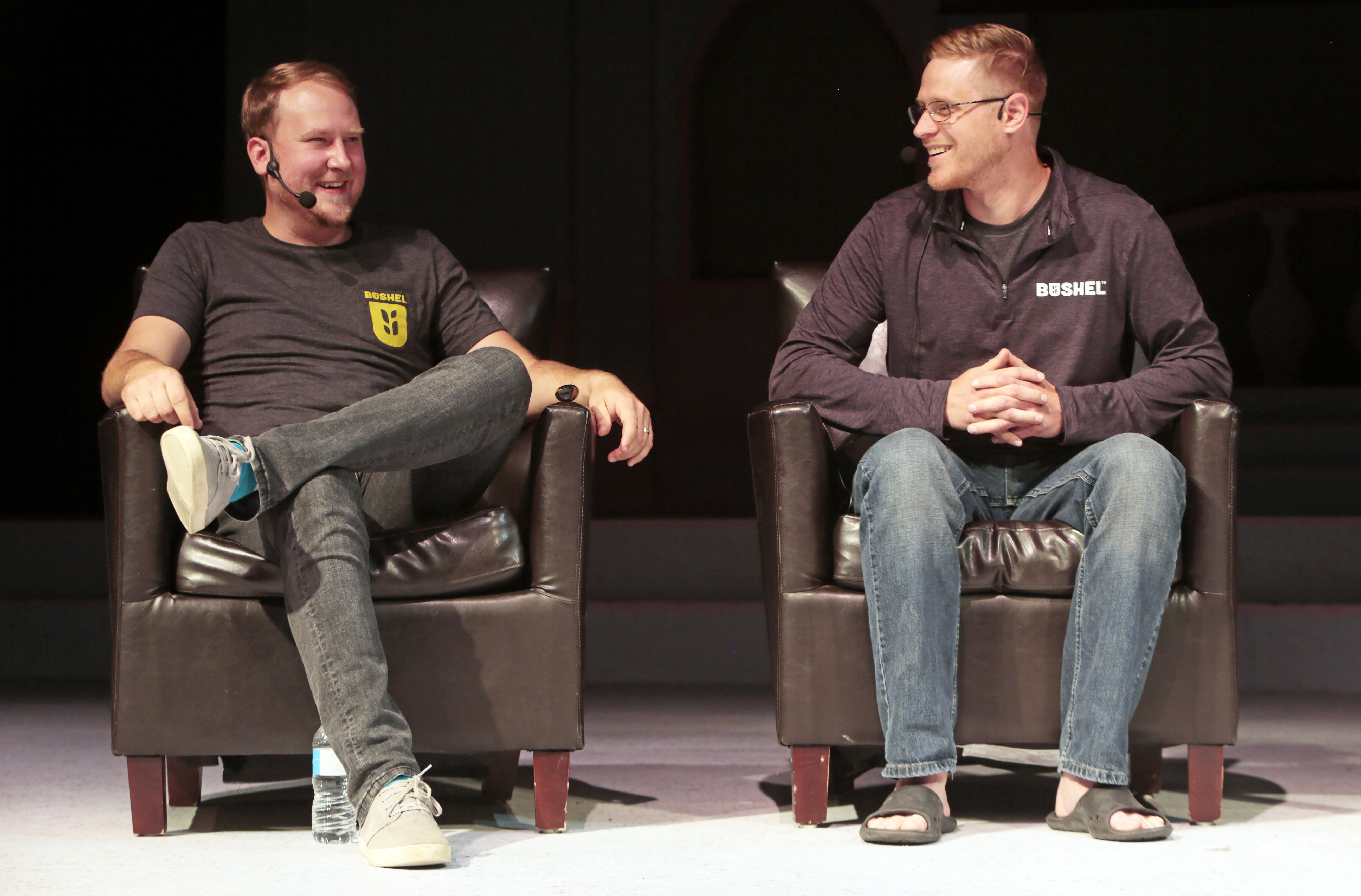 Jake Joraanstad and Ryan Raguse seated onstage in Bushel shirts during a 2019 conversation
