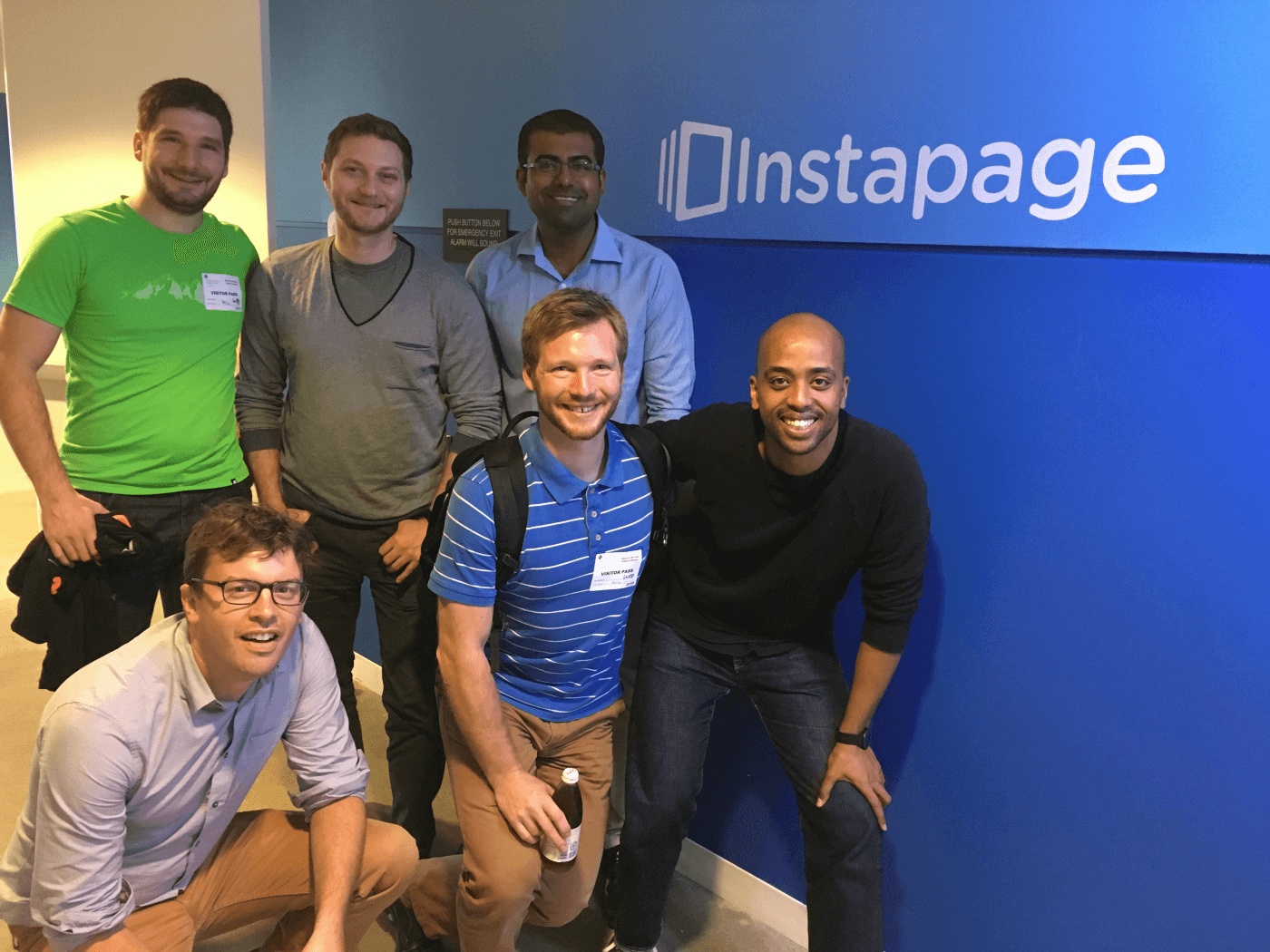 Jakub and Ondrej Sedlacek visiting the Instapage team, with Jakub standing at the far left in a green shirt