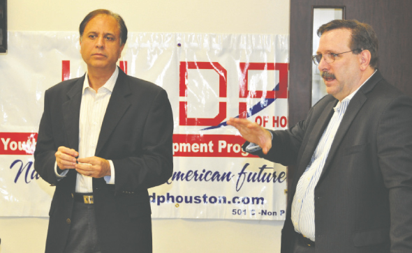 Arun Pasrija on the left and James Taylor speaking on the right at a youth leadership session