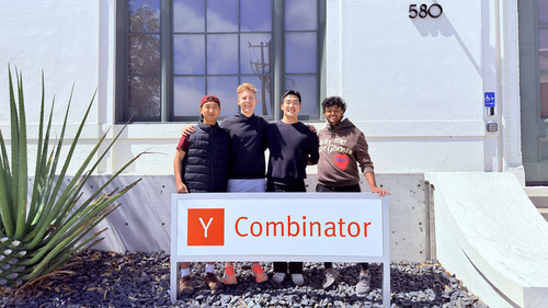 The four members of the 6thSense founding team standing behind a Y Combinator sign