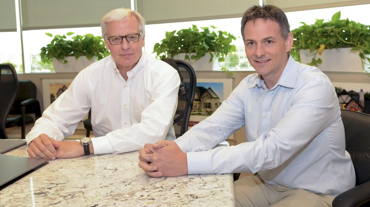 James Brickman, left, and David Einhorn seated together at a conference table