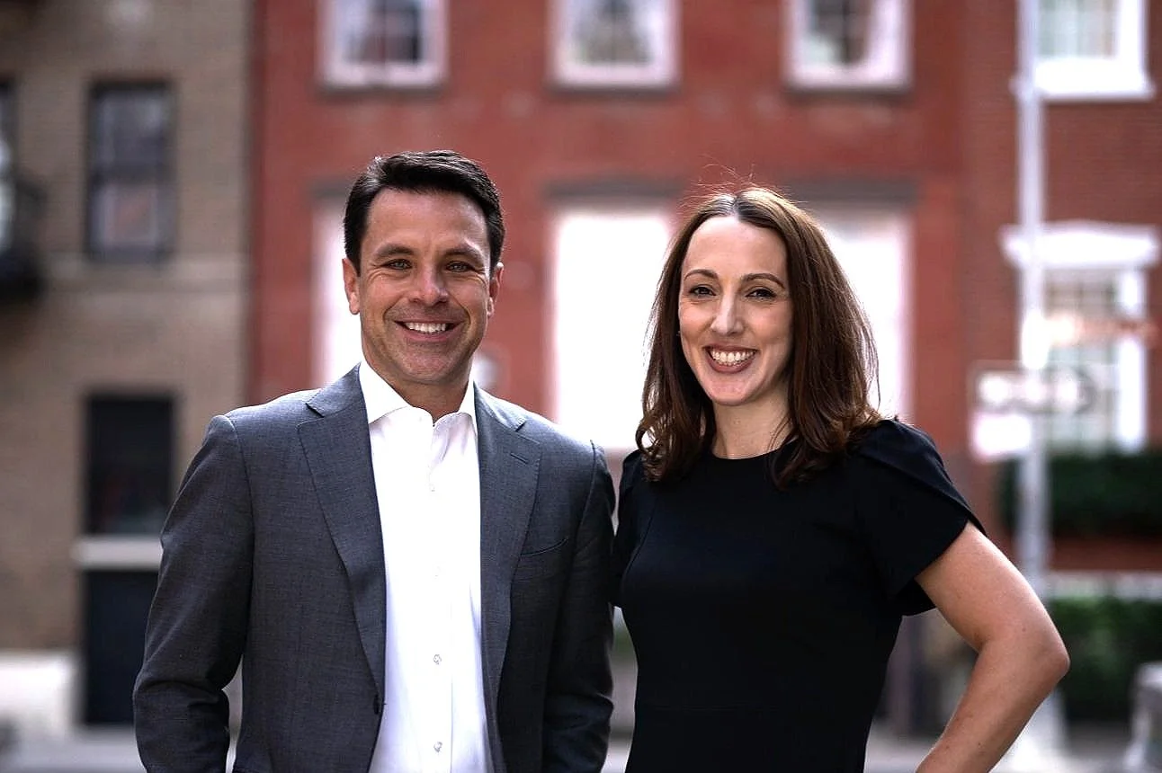 James Brune, left, and his brokerage colleague Katherine Cappello, standing outdoors