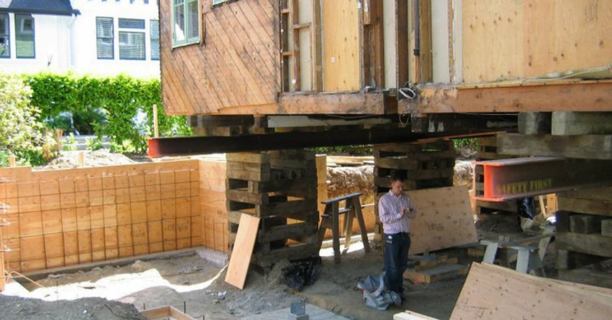 James DeGreef standing beneath his raised house during renovation