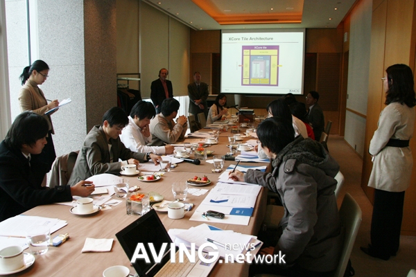 XMOS’s 2007 Seoul press presentation, with Foster standing near the screen and journalists seated around a table