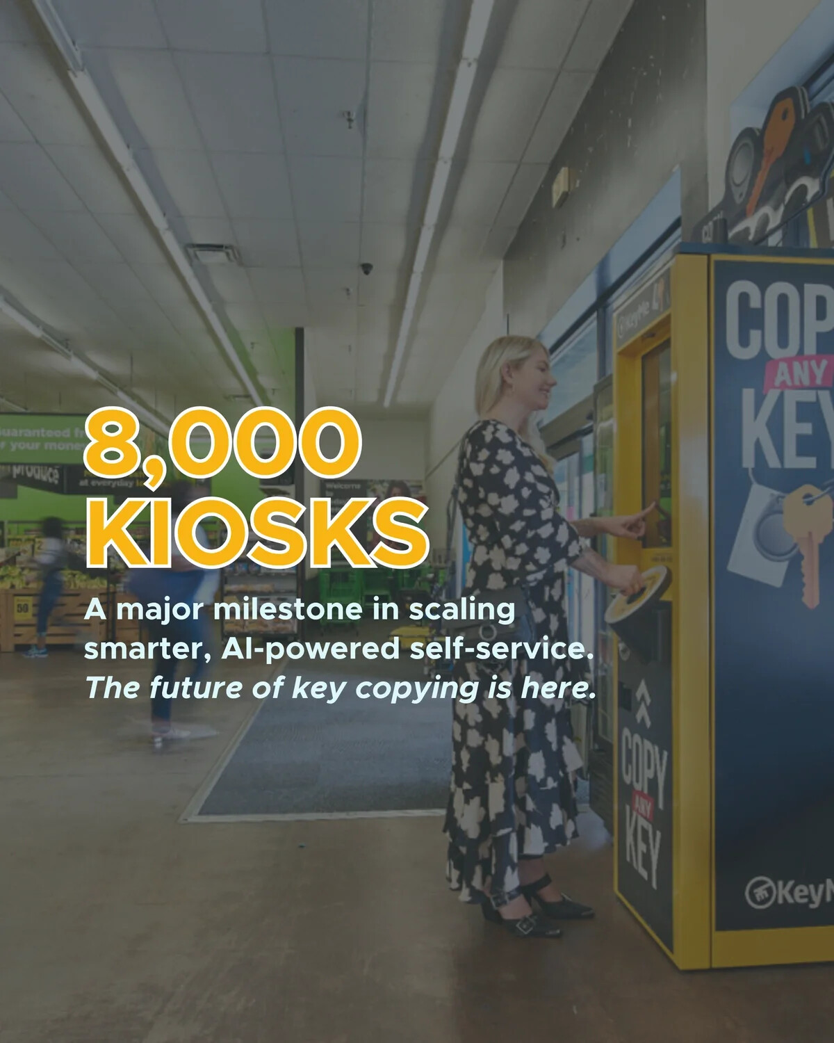 A customer uses a yellow KeyMe key-copying kiosk inside a retail store