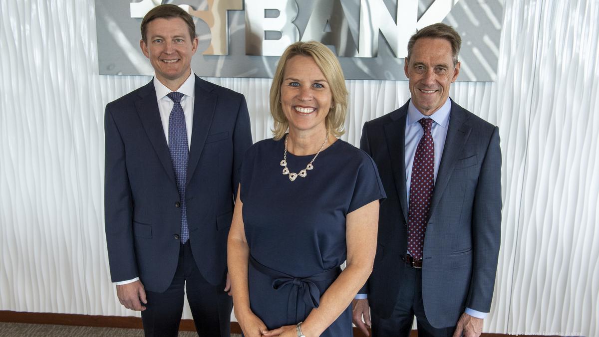 Kevin Classen, Emily Robinson and Jim Reuter standing together at FirstBank headquarters in 2021