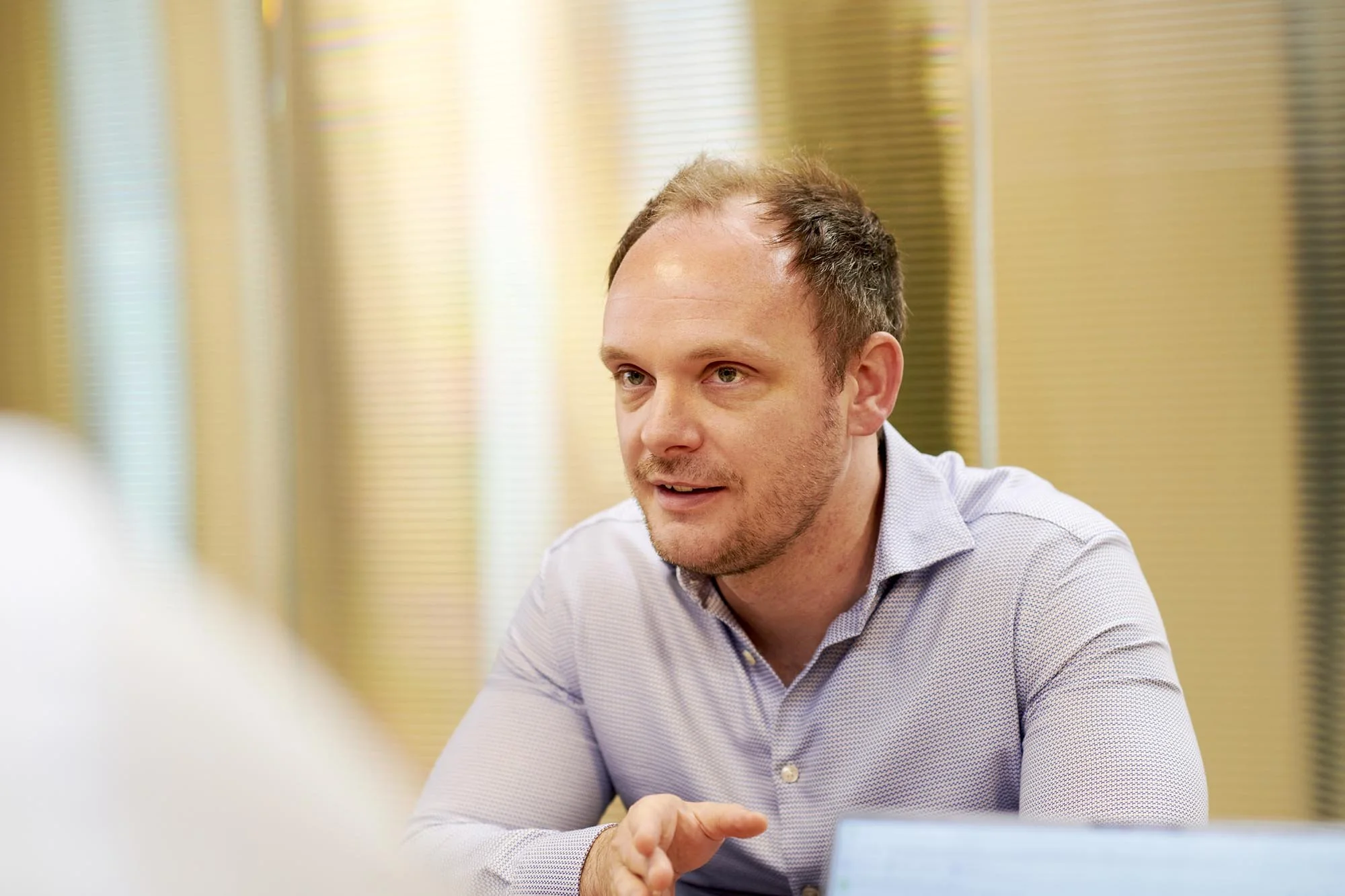 James Weatherill in conversation at a meeting table