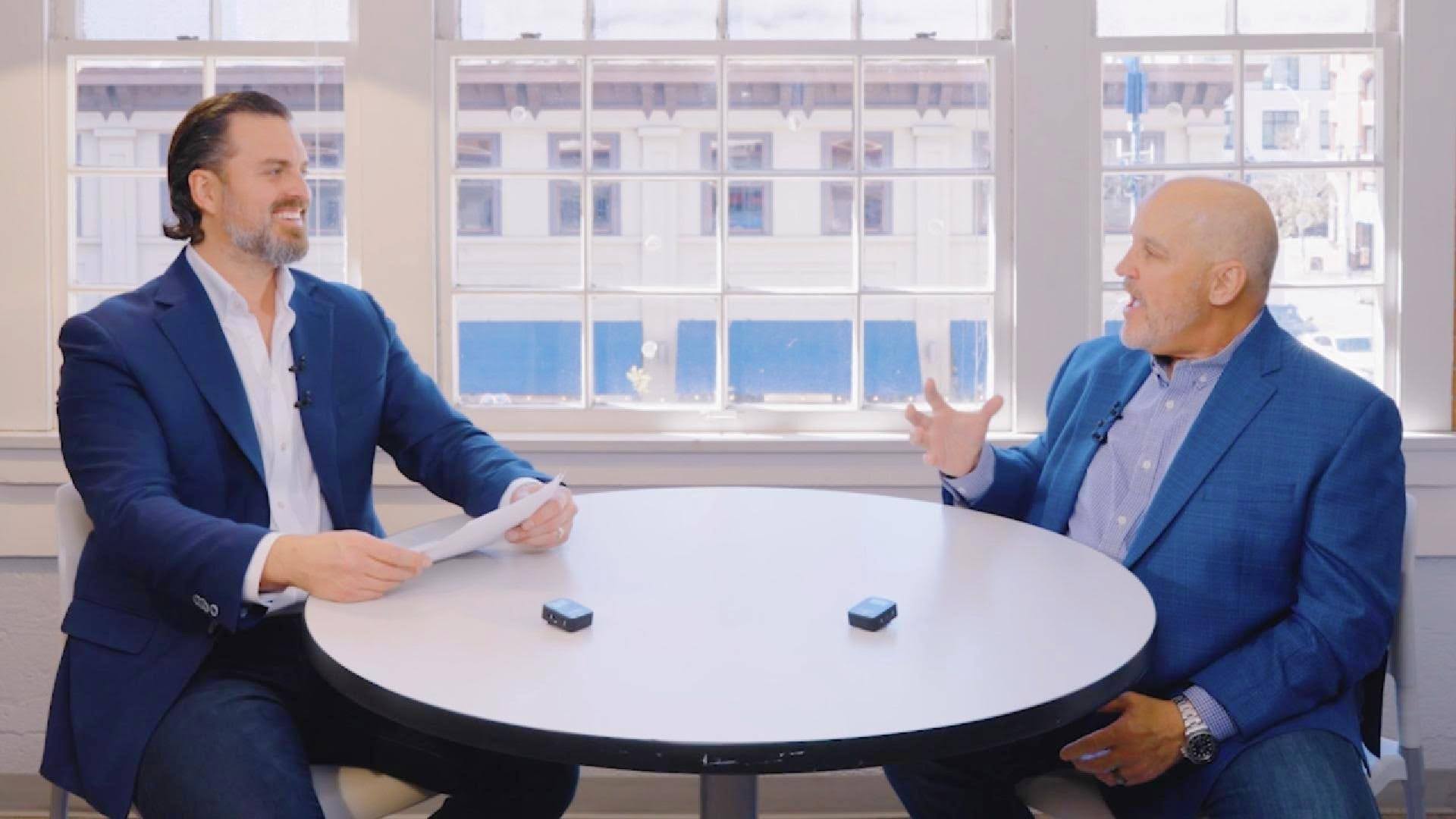Jamey Vumback speaking with Power100 CEO Greg Cummings during an interview