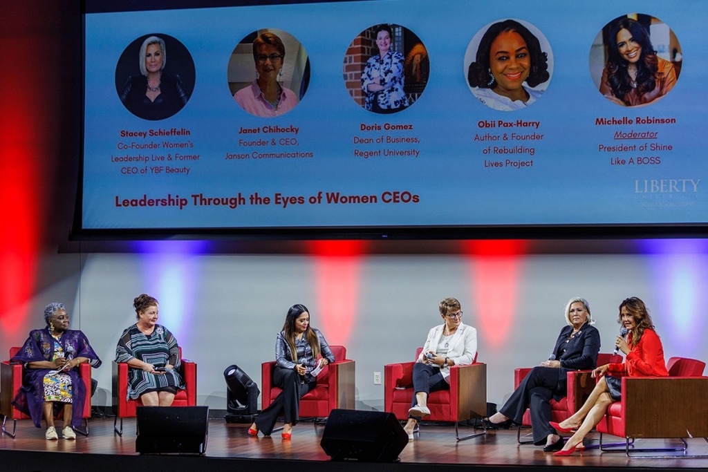 Janet Chihocky, seated fourth from the left, taking part in a women CEOs panel at Liberty University in 2022