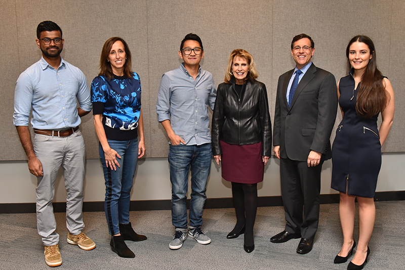 Janette Hausler stands with fellow alumni and SUNY Oswego leaders at an Upskilling in a Digital World event in 2019