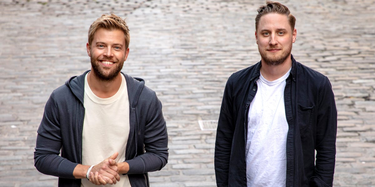 Jannick Malling and Leif Abraham standing together on a cobbled street