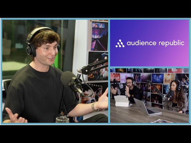 Jared Kristensen speaking into a microphone during Fear at the Top, with Luke Girgis and Poppy Reid