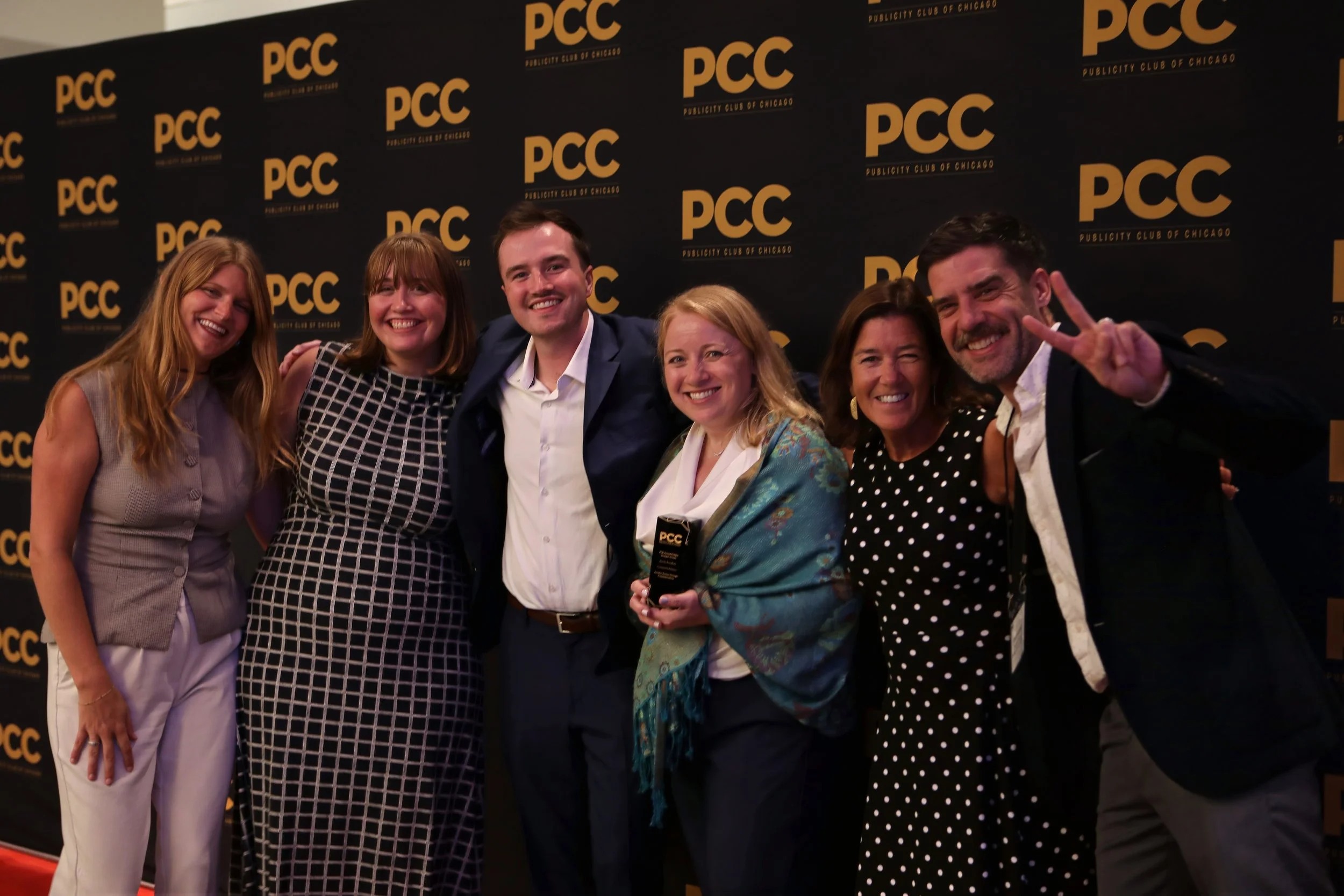 Jasculca Terman team members celebrating at the 2025 Golden Trumpet Awards