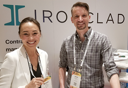 Jason Boehmig, at right, standing with a fellow attendee at an Ironclad conference booth