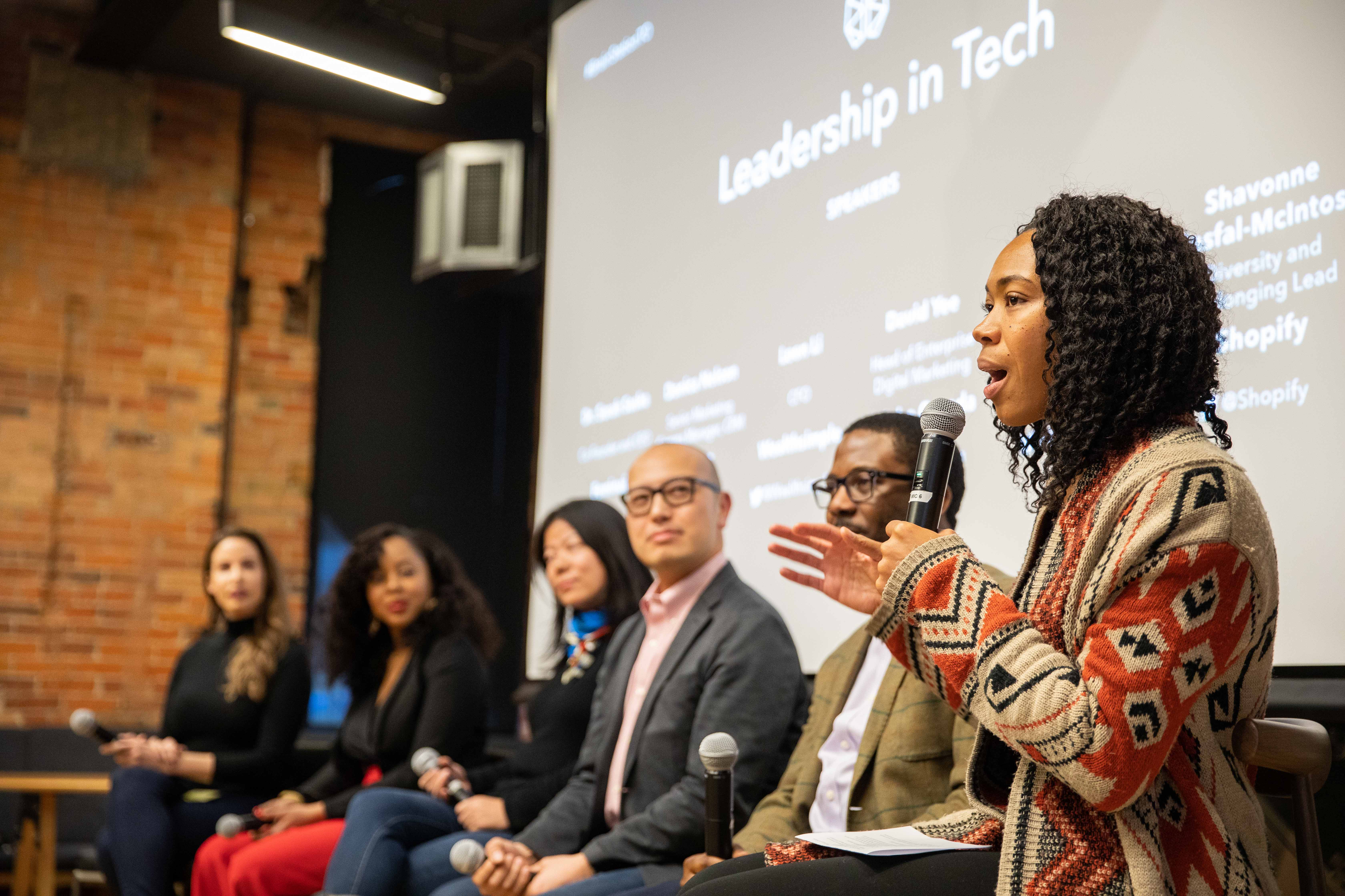 A speaker addressing an audience during a BrainStation leadership panel