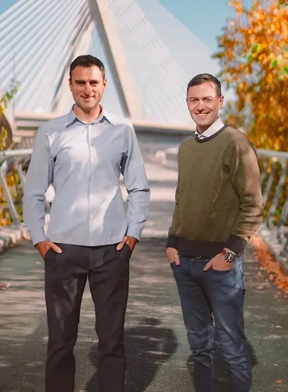 Electives co-founders Krikor Dzeronian, left, and Jason Lavender, right, standing outdoors near a cable-stayed bridge