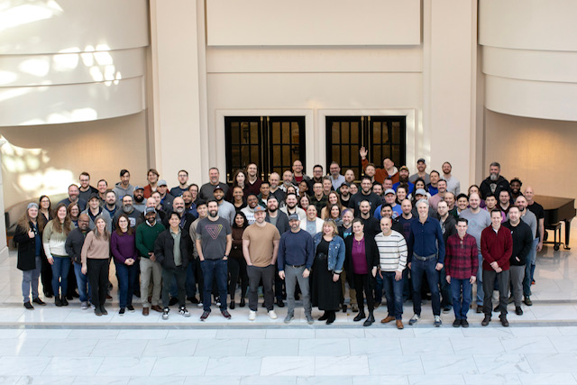 A large group of Stable Kernel employees gathered at a company retreat at Chateau Elan