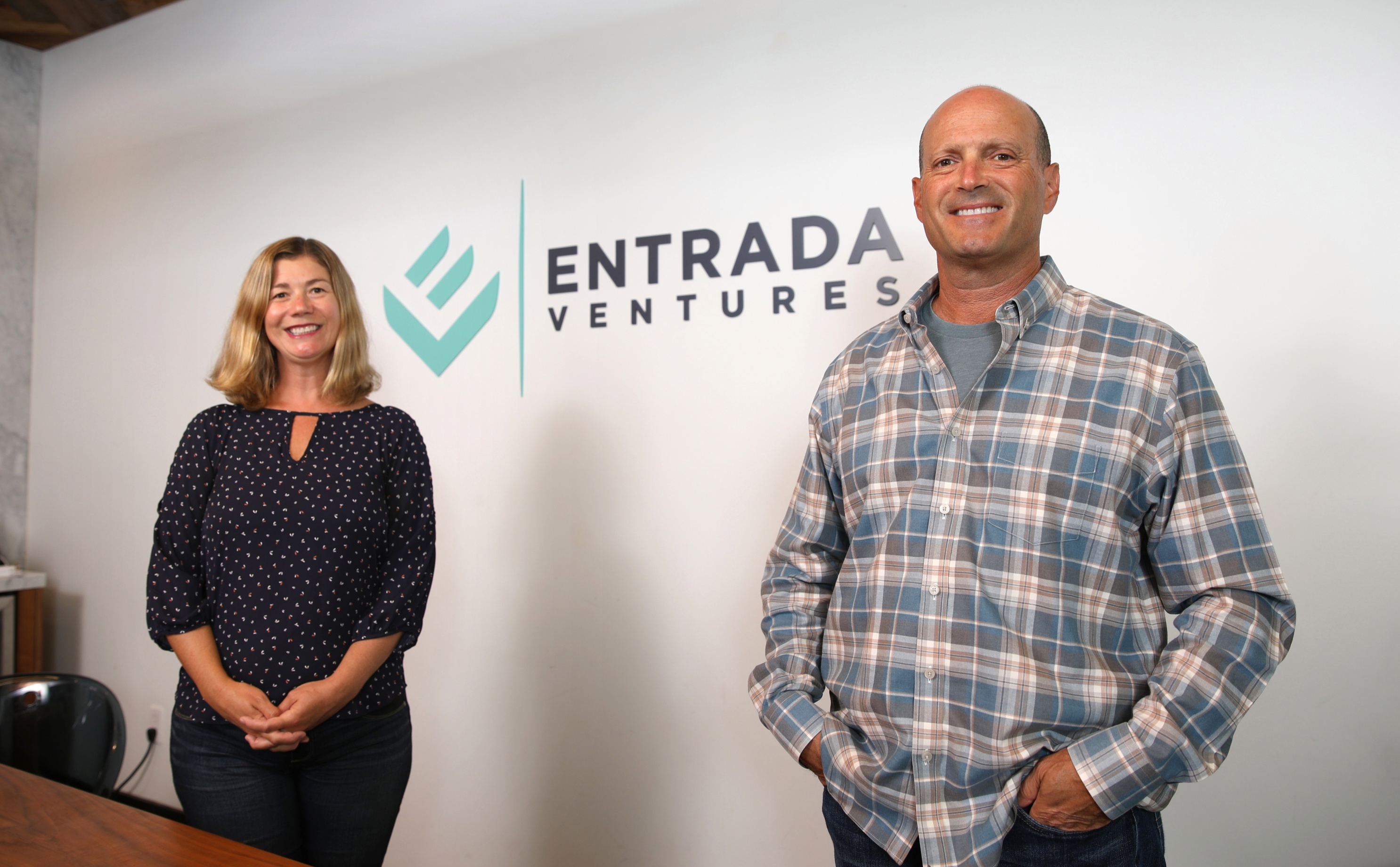 Julie Henley McNamara, left, and Jason Spievak standing at Entrada Ventures