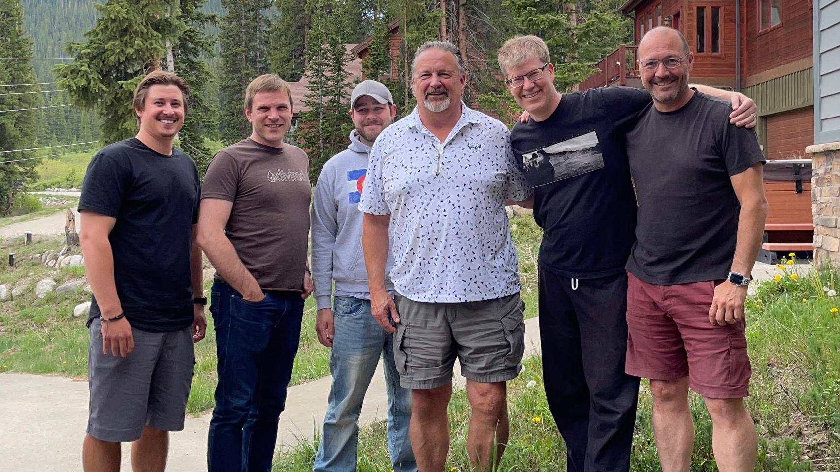 Javier Marti standing with five Divirod colleagues outdoors in Colorado