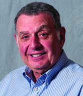 Jay M. Jaffe wearing a striped shirt in an archival portrait