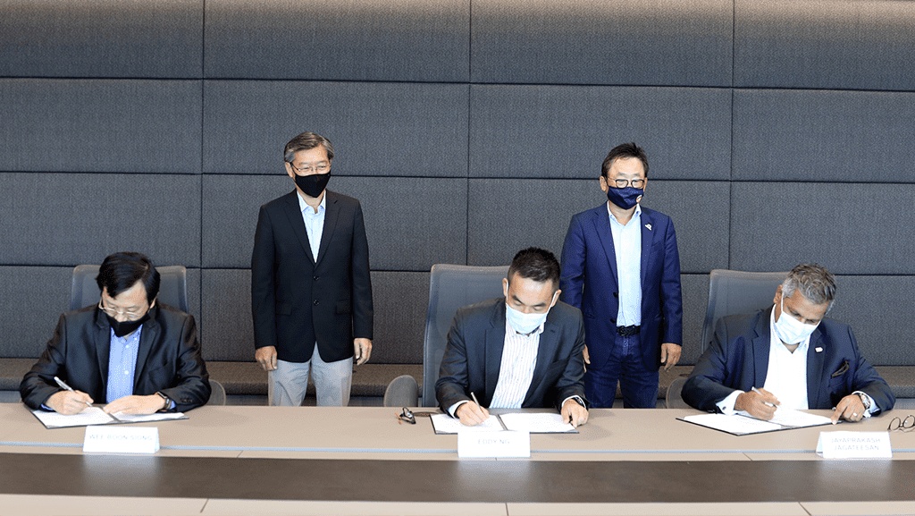 PSA and RHT representatives signing their August 2021 agreement, with Jayaprakash Jagateesan seated at right