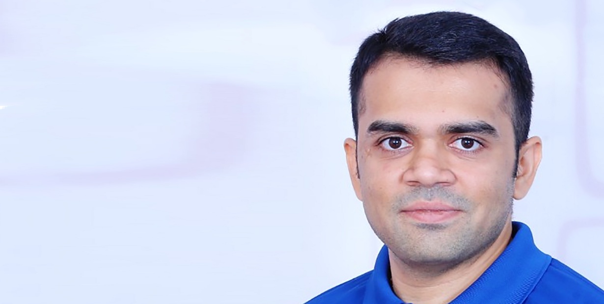 Jayneel Patel in a blue polo shirt, photographed for his 2020 interview