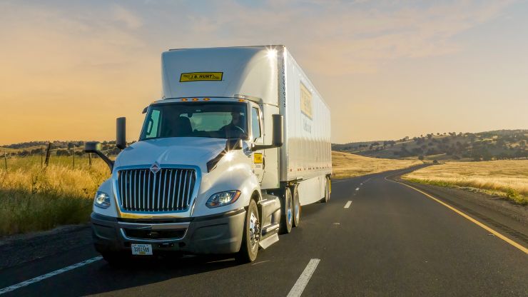A J.B. Hunt tractor-trailer travelling on a remote highway
