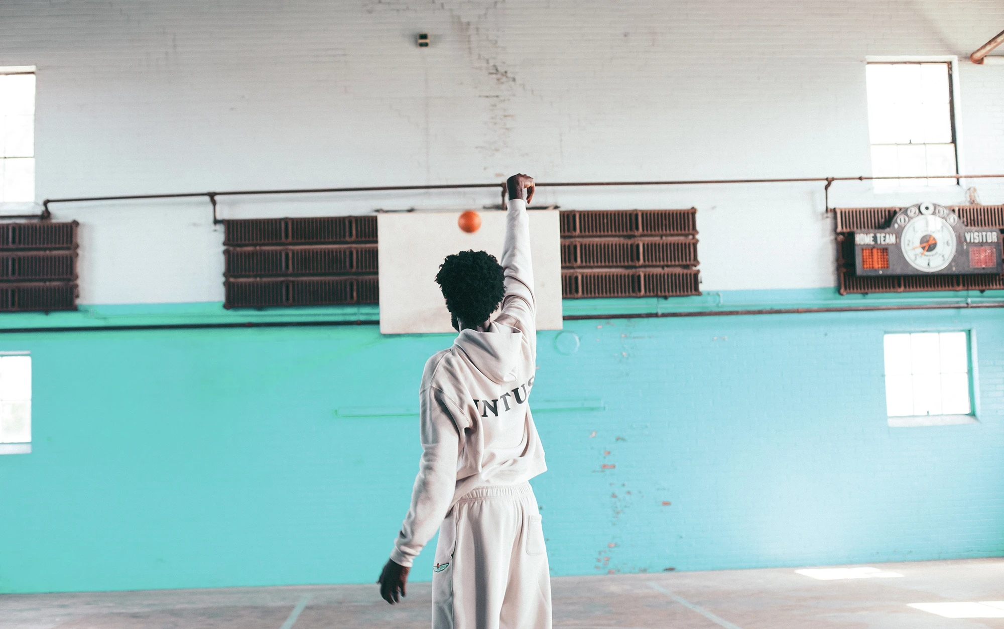 Jonathan Isaac wearing Unitus apparel while shooting a basketball