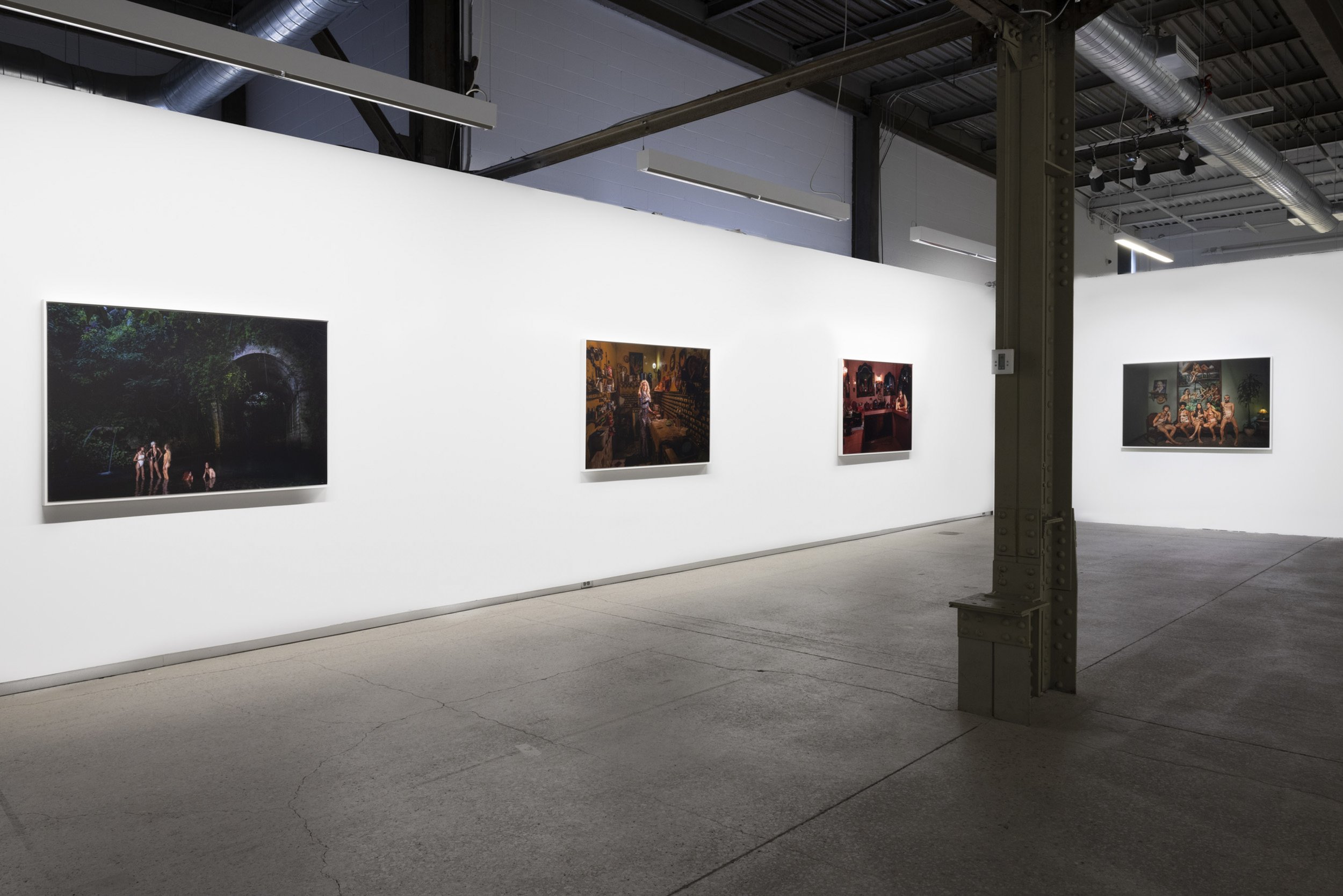 Photographs from The New Cubans displayed on white gallery walls at Blouin Division
