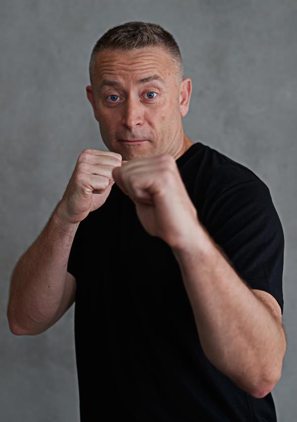 Jean-Michel Fournier in a playful boxing pose during his Les Mills Media years