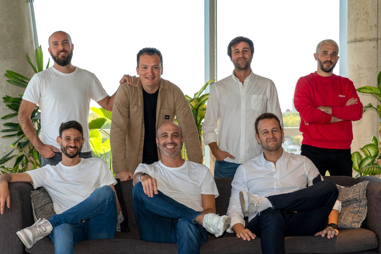 CoreZero leadership team posing together in 2022, with Jean Pierre Azanedo seated in the centre