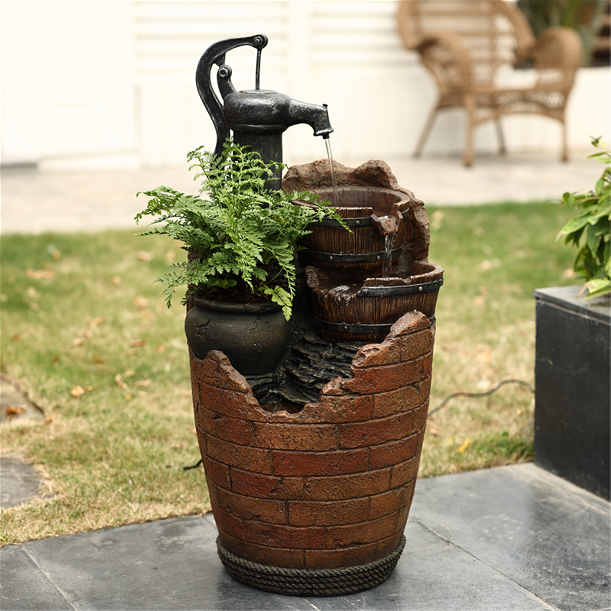 JECO Glenville fountain with a decorative hand pump, barrel-shaped bowls and integrated planter