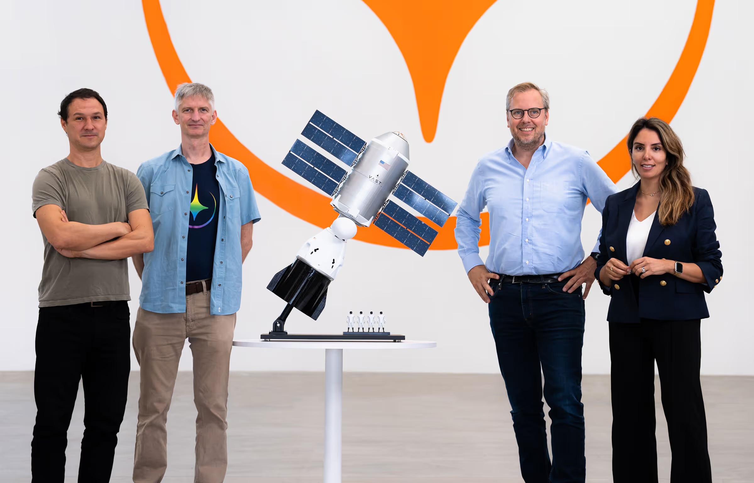 Jed McCaleb, Alex Hudson, Max Haot and Krystle Caponio stand around a model of a Vast space station in 2023