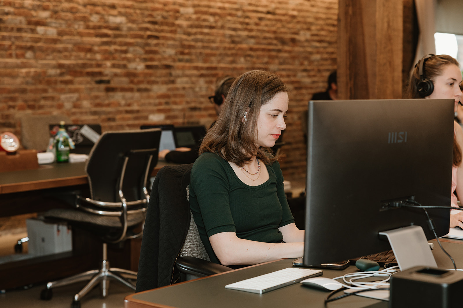 A member of Jedify’s team working at a desk in its office