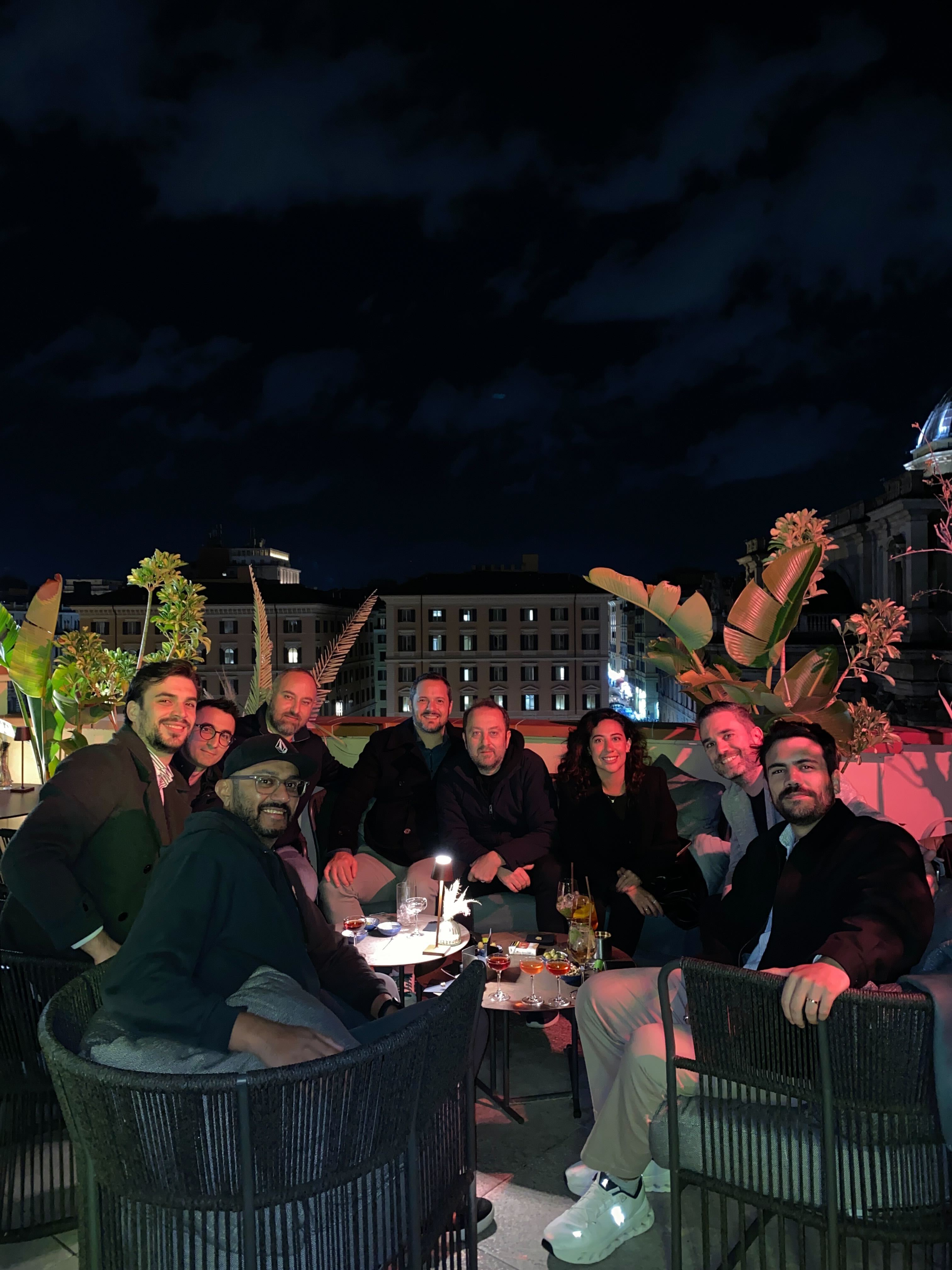 Group photograph published on Jeeves’s company page, gathered around a table outdoors at night