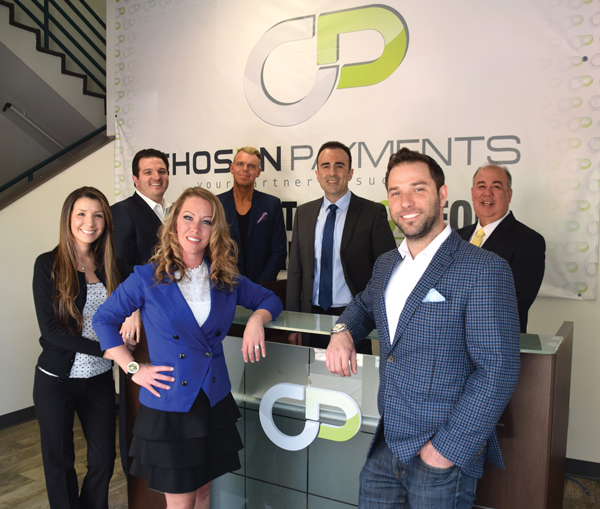 Jeff Brodsly with the Chosen Payments livery team in the company's office
