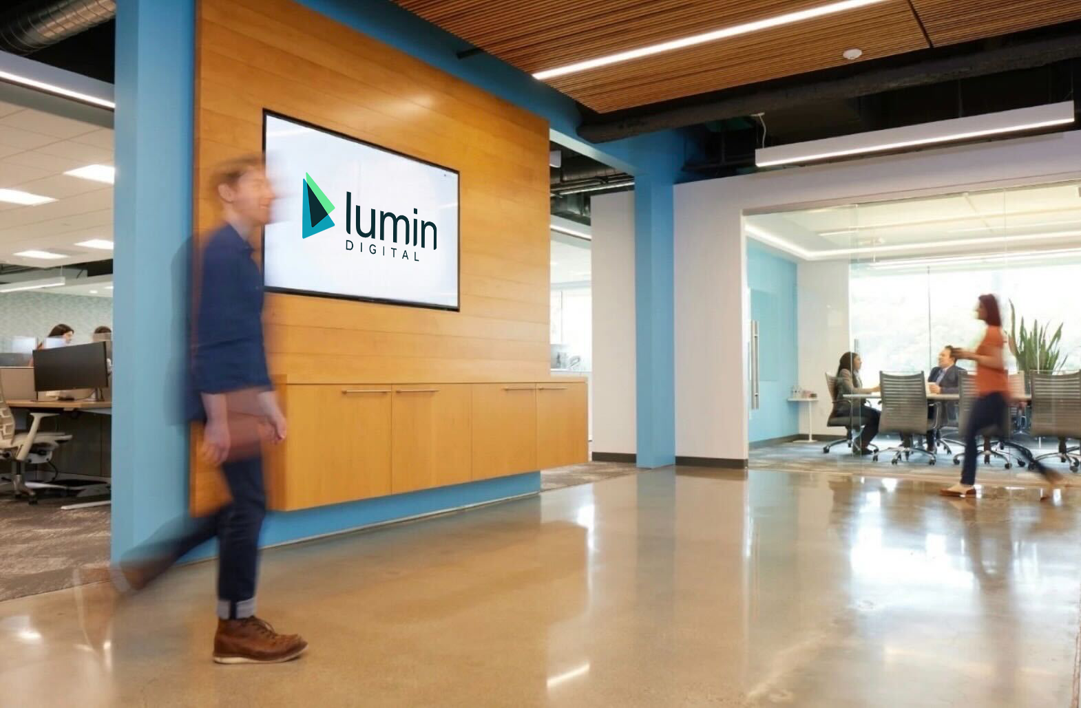 Lumin Digital office lobby with a meeting room behind glass