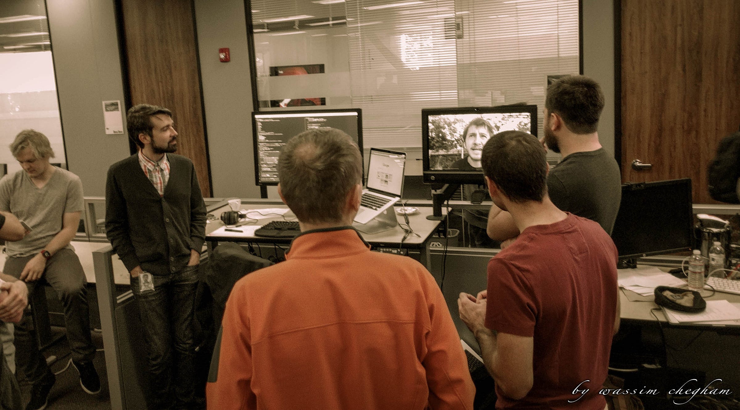 Members of the Angular community gathered around monitors at ng-conf 2016, with Jeff Cross at right