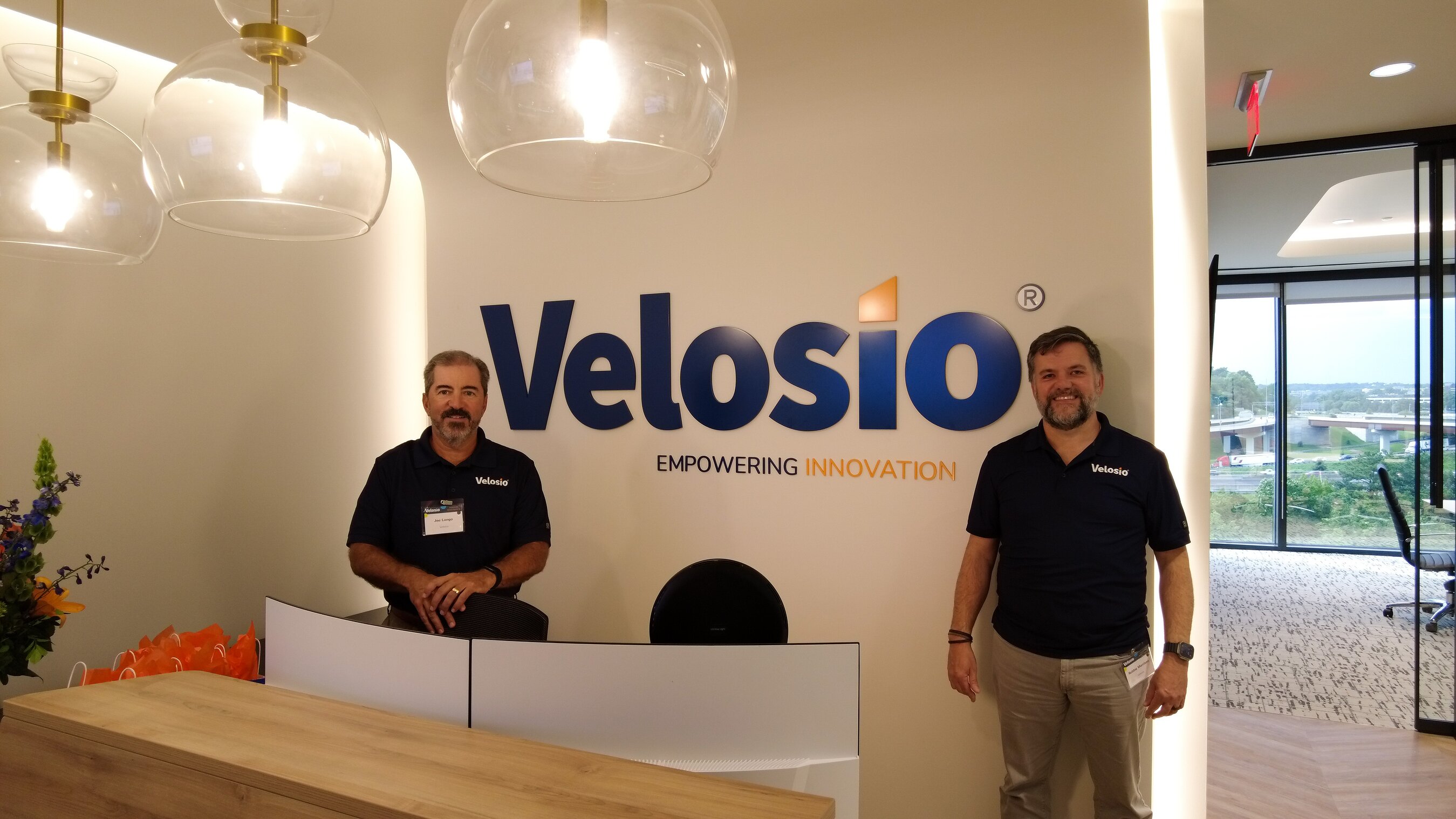 Velosio co-founder Joe Longo and CEO Robbie Morrison at the Atlanta headquarters grand opening in July 2025