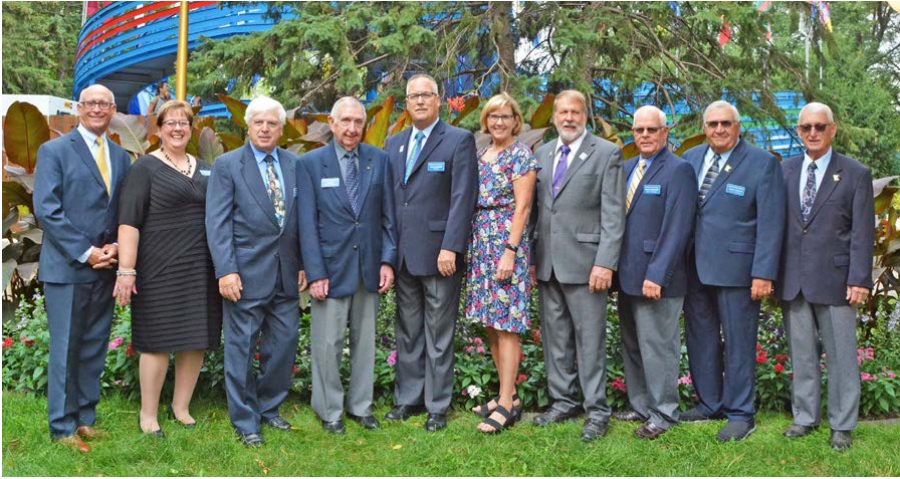 Minnesota State Fair board members posed outdoors; Jeff Hawkins stands at the far left.