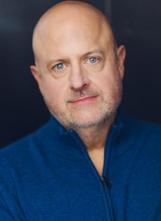 Jeff Hunter in a blue quarter-zip, as pictured on Dive In’s team page