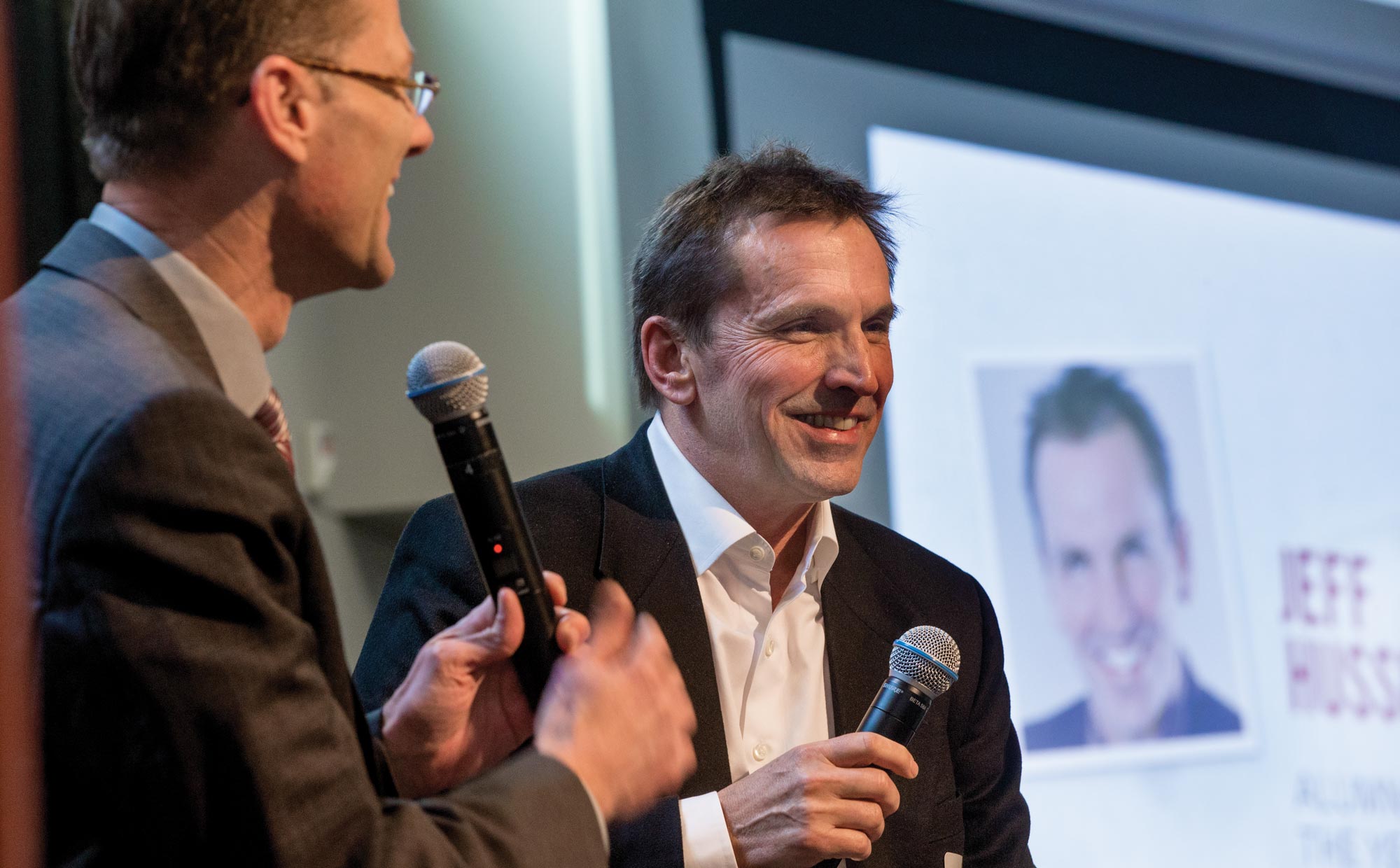Jeff Hussey, right, speaking with Seattle Pacific University president Dan Martin at the alumni awards luncheon