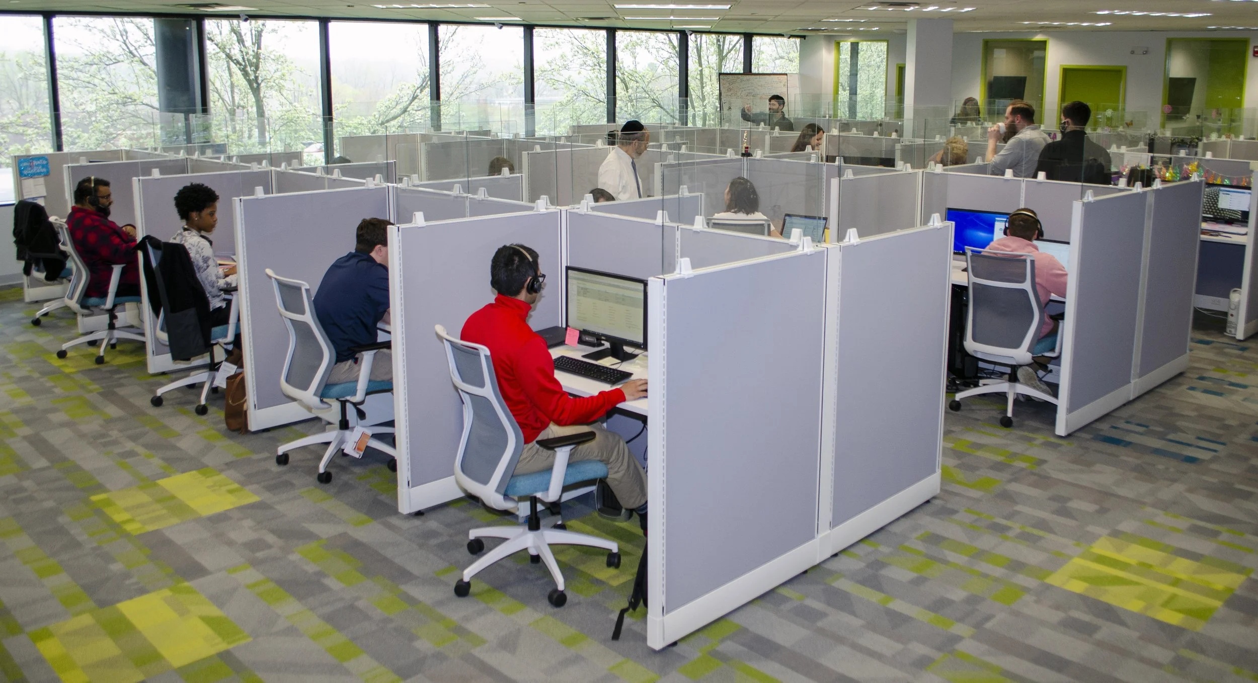 Customer support staff at desks in iPostal1's New York headquarters