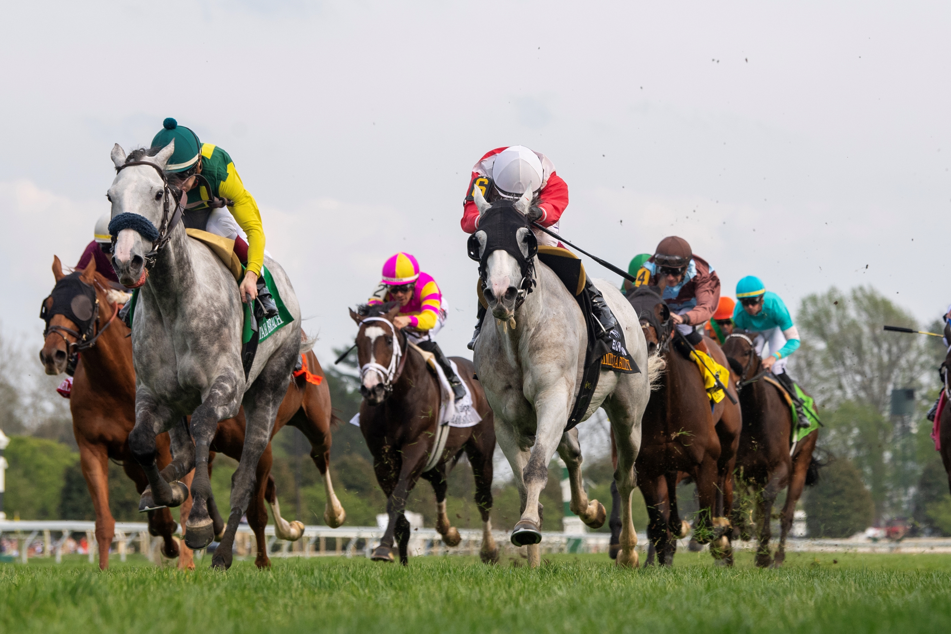Utah Beach in a green cap battles Limited Liability to win the 2025 Elkhorn Stakes at Keeneland