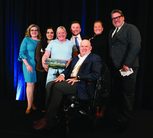 Jeffrey Forbes, at far right, with Dan Tate and other attendees at the 2024 Bryce Harlow awards dinner