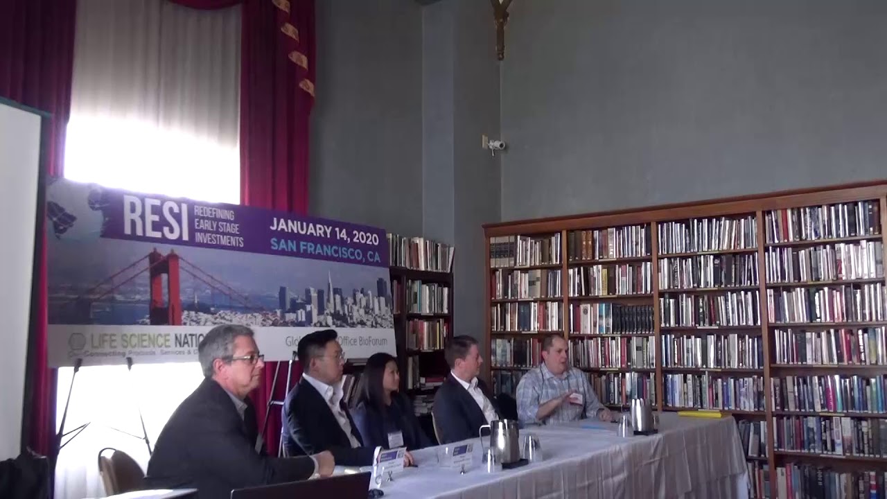 Five panelists, including Jeffrey Cleland, seated at a RESI term-sheet workshop in a room lined with books
