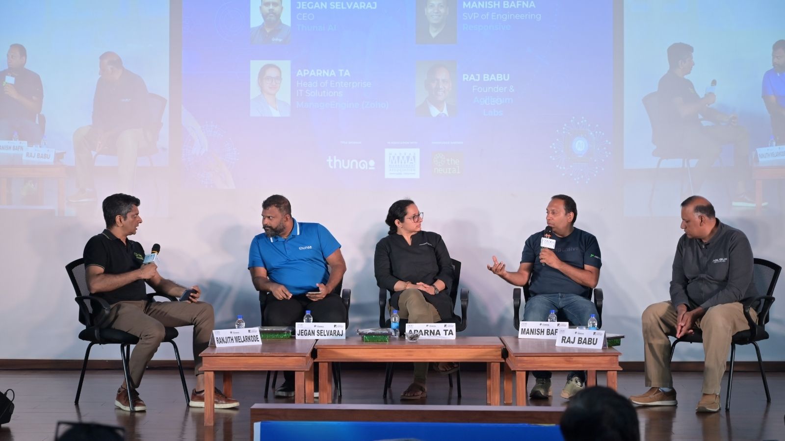 Jegan Selvaraj, second from left in a blue shirt, seated with four other speakers at the COGNI panel in Chennai
