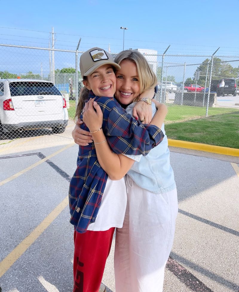 Drew Barrymore, left, and Jenn Drago Ericksen smiling and embracing outdoors during their 2024 trip